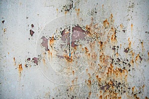 Old corroded metal wall background with flaky gray paint .Rusty flaky cracked metal surface.Abstract the surface texture of the