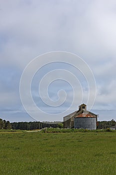 An old corrugated clad Barn and circular Grain Silo situated in the Farmlands near to Montrose Beach