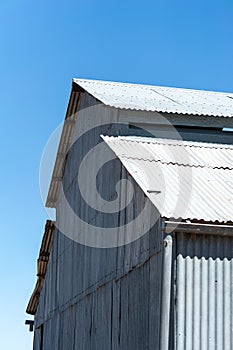 Old corrugated iron wool shed on outback station in Australia