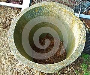 Old cottage concrete well or pipe photo