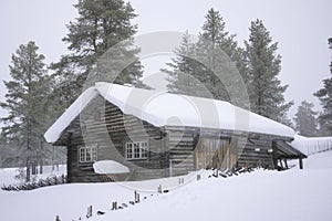Old cottage in scandinavia winter wonderland