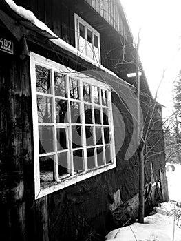 Old cottage on snow