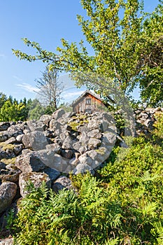 Old cottage at a stone cairn in the countryside