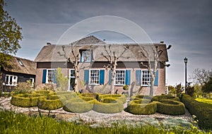 Old cottage with topiary garden