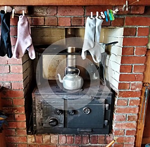 Old cottage wood fire stove photo