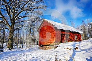 Old cottages, houses in a snowy winter landscape