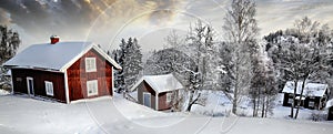 Old cottages in a snowy winter landscape