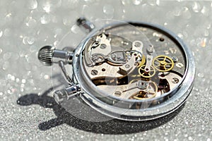 An old countdown timer opened up showing all the details of the mechanism, macro closeup