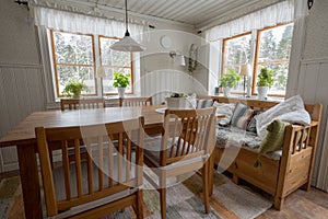 Old country style kitchen in sweden with table chairs and a sofa