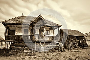 Old countryside house and an old barn in a Romanian village