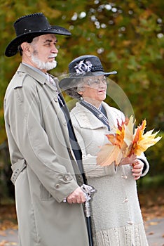 Old couple in autumnal park