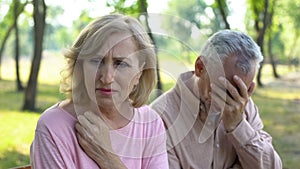 Old couple crying, frustrated with illness of close relative, problems despair photo