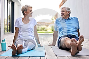Old couple, happy and talking after yoga on deck for wellness, workout and exercise in nature. Senior man, woman and