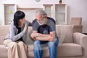 Old couple having argument at home