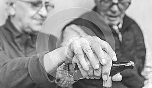 Old couple holding each others hands