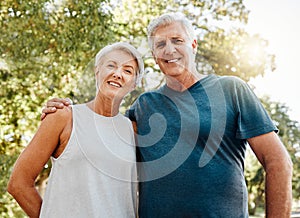 Old couple, hug and nature portrait smile outdoors, park or outside on break after running, walk or exercise. Health