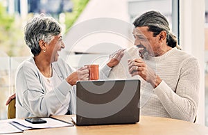 Old couple, laptop and laughing with retirement and coffee, manage finance paperwork and funny together at home. People