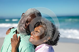 Old couple in love at the beach