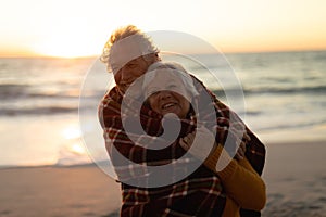 Old couple in love at the beach