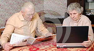 Old couple reading hot news