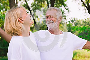 Old couple relax together in the park