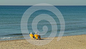 Old Couple relaxing by the sea