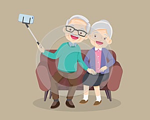 Old couple take selfie on smartphone on sofa