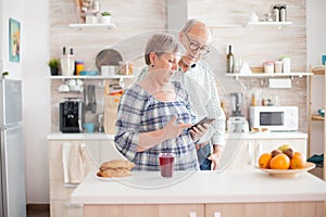 Old couple using smartphone