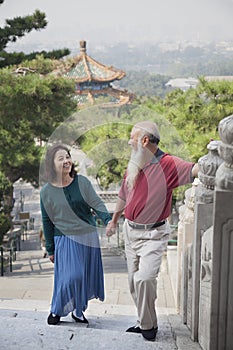Old Couple Walking In Jing Shan Park, Holding Hands photo