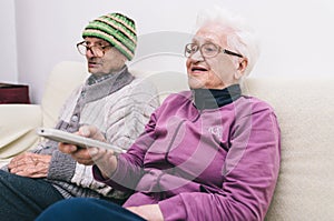 Old couple watching television
