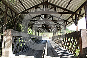 Old covered wooden bridge, wooden truss structure