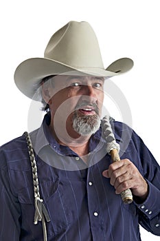 Old cowboy holding bullwhip