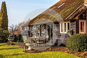 Old cozy house with thatched roof in Giethoorn, Netherlands