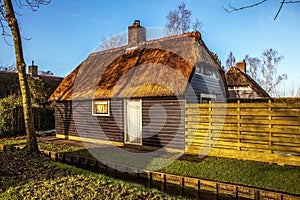 Old cozy house with thatched roof in Giethoorn, Netherlands