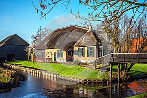 Old cozy house with thatched roof in Giethoorn, Netherlands