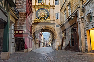 Old cozy street in Rouen with famos Great clocks or Gros Horloge of Rouen, Normandy, France