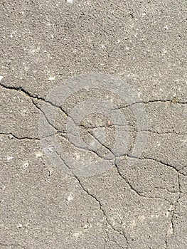 Old cracked asphalt on a sunny day