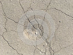 Old cracked asphalt on a sunny day