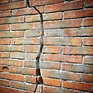 Old cracked brick wall - wall built in the 16th century