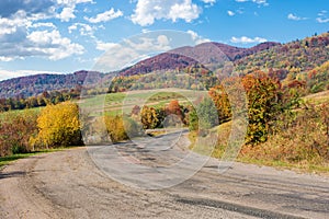 old cracked country road through mountainous landscape