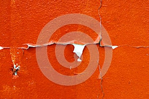 Old cracked orange paint background texture wall