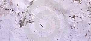 Old cracked rought white plaster wall texture banner background