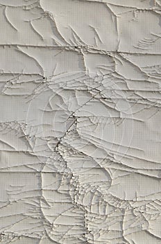 Old cracked white plastic surface close