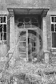 Old, creepy, abandoned building doorway.