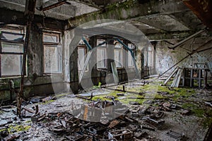 Old. creepy, corrupted room covered in moss in the building located in the Chernobyl ghost town