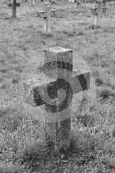 Old cross in the military cemetery. Black And White.