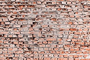 Old crumbled brick wall texture background.