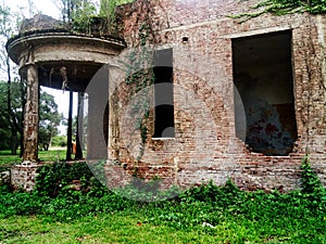 Old crumbling brick house in ruins