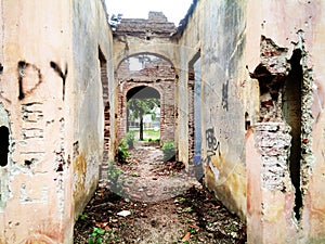 Old crumbling brick house in ruins photo