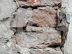 Old red brickwork walls, cement plaster. retro background for your photos and text
